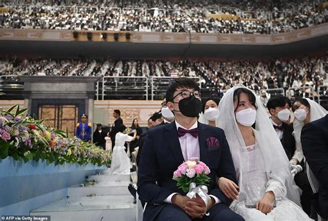 Thousands Of Couples Marry At Mass Church While Covering Faces During