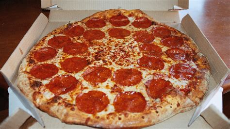 Sicily is known for thick crust pizza. In A Lawsuit, New York Accuses Domino's Pizza Of Wage ...