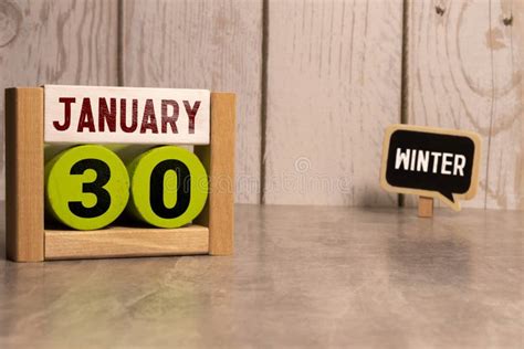 Cube Shape Calendar For January 30 On Wooden Surface With Empty Space