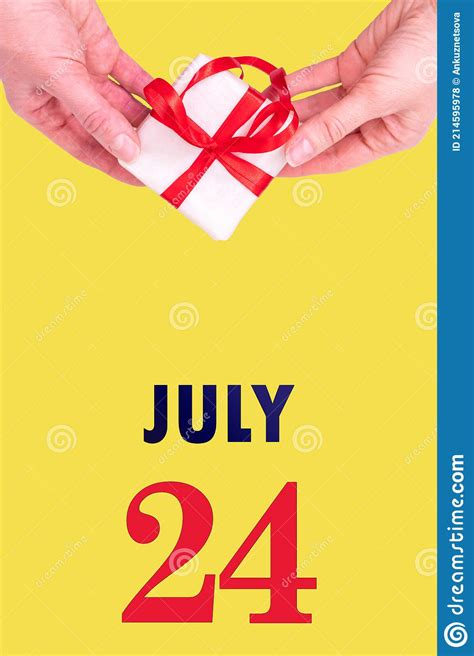 July 24th Festive Vertical Calendar With Hands Holding White T Box
