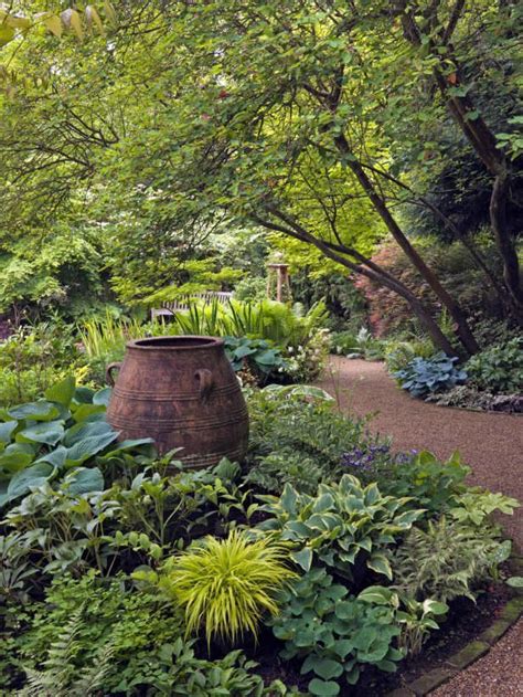 Big ideas for a small yard. Front yard shade garden inspiration - add piece of art ...