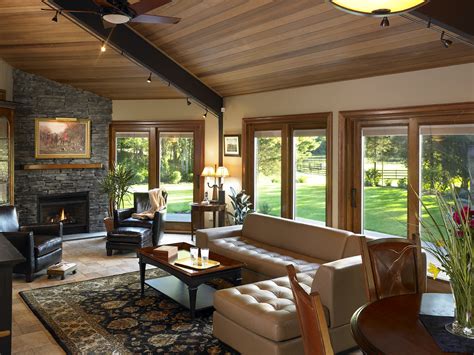 Here, a long rectangular room has a central fireplace, windows to the front and glass doors/garden access to the rear. Living room with fireplace and French doors | The French ...