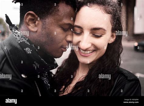 Mixed Race Couple In The Rain At Street In Munich Germany Stock Photo