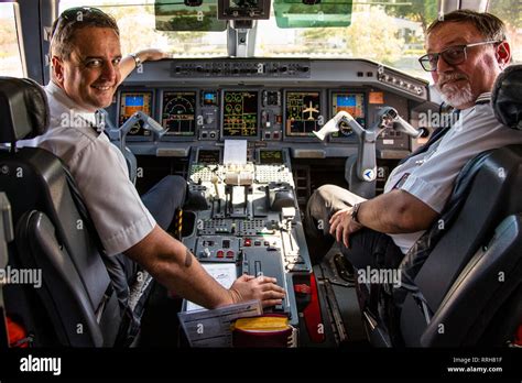 Pilot and Copilot in Cockpit on Ground Stock Photo - Alamy