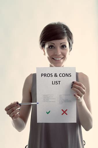 Portrait Of A Woman Showing An Organized List Of Pros And Cons Stock