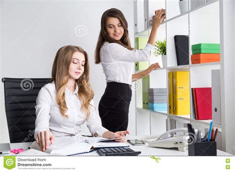 Secretaries working stock photo. Image of professional - 76713702