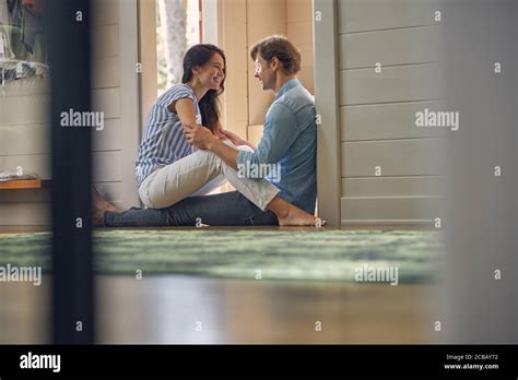 Smiling Young People Sitting Opposite Each Other Stock Photo Alamy
