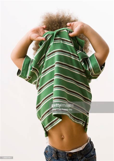 Mixed Race Babe Taking Off Shirt Photo Getty Images