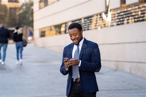 Young Handsome Businessman Using Mobile Phone App Sending Message