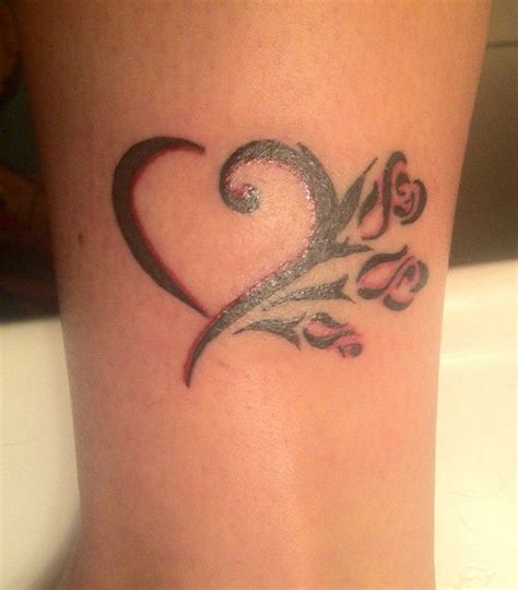 Flying heart entwined in climbing rose. heart and roses | Infinity tattoo, Hearts and roses, Tattoos