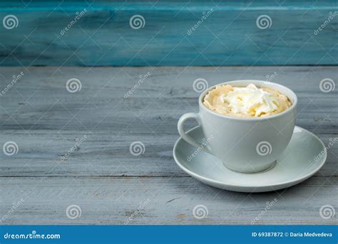 Cup Of Coffee With Whipped Cream On Wooden Background Stock Photo