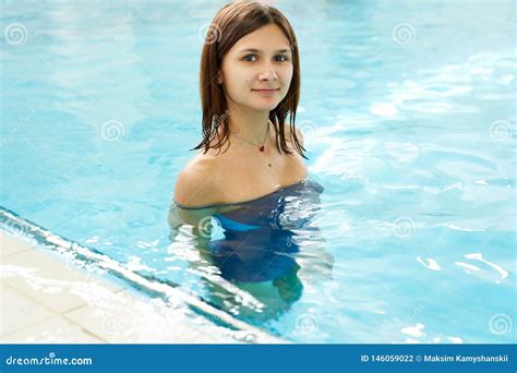 Portrait Of A Fit Young Woman In The Swimming Pool Happy Smiling Swimmer Female In The Pool