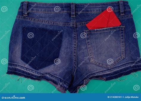 Blue Denim Shorts Close Up Back View On Blue Background Next To Empty Area There Is Not