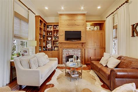 Pure whites invite just about any accent colors. Living room; neutral colors; cowhide rug; linen panels with trim; white walls; warm living ...