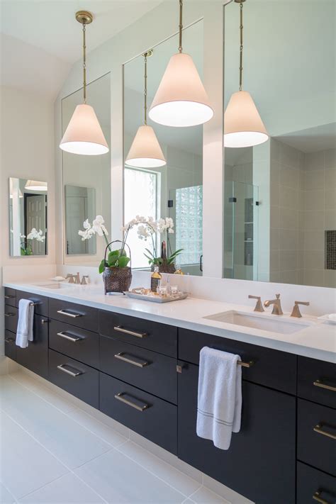 Audrey hall this tiny bathroom by envi interior design studio, via houzz, has more farmhouse than modern, but still meets the definition of a modern farmhouse.the small space is made to look bigger, thanks to a reflective tile in a neutral shade, and a large frameless mirror. A Beautiful Alternative For Lighting In The Bathroom — DESIGNED