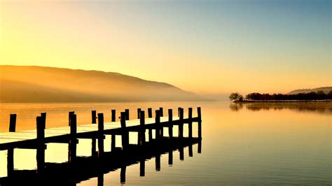 Download Wallpaper 1366x768 Lake Pier Fog Sunset Dusk Tablet