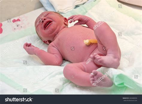 Newborn Baby Boy Crying In Maternity Hospital Stock Photo