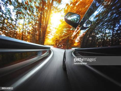 Yellow Car Driving Away Photos And Premium High Res Pictures Getty Images