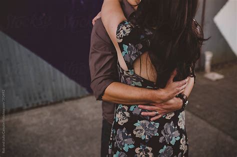 Young Stylish And Romantic Couple Hugging Guys Arms Holding Girls