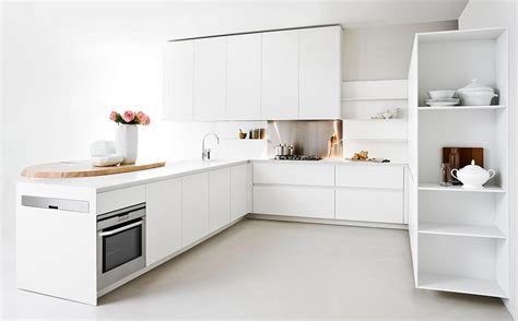 White kitchen cabinets are classic and usually a safe design decision. Modern Kitchen With Space-Saving Solutions, Design Ideas