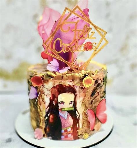 A Close Up Of A Cake On A Plate With An Anime Character And Flower