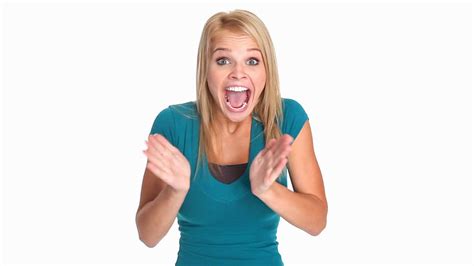 Excited Young Woman Waving Her Hands And Laughing Enthusiastically