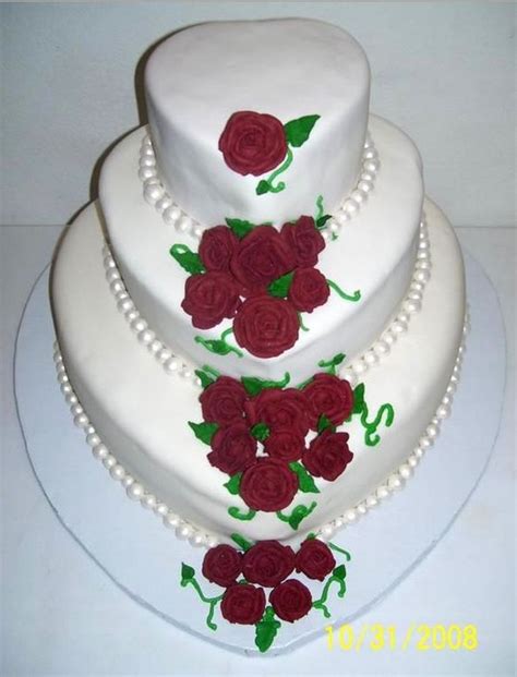 Heart Shaped 3 Tier Wedding Cake With Rose Pedals And Pearls