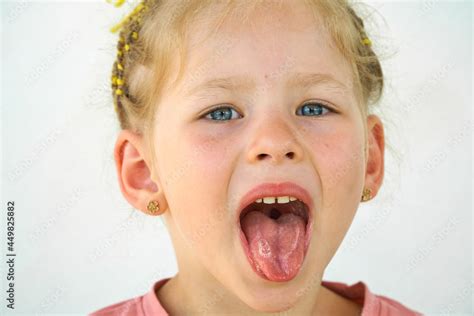 Cheerful Child Girl Laughs Close Up Of The Face On A White Background