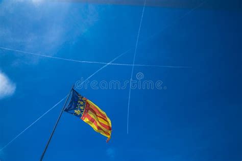 Catalonia Flag In Valencia Spain On The Blue Sky Background Stock