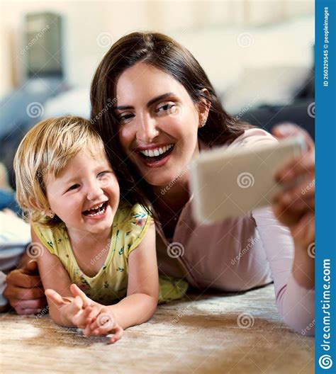 Moms Cute Little Munchkin A Happy Mother And Her Adorable Daughter Taking Selfies Together At