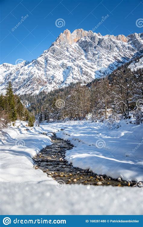 Sunny Winter Landscape In The Alps Mountain Range River