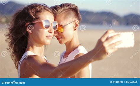 Young Happy Lesbian Couple Doing Selfie On The Beach Stock Video