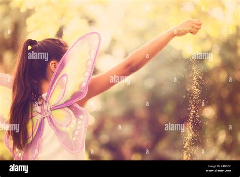 Girl 8 9 Spreading Fairy Dust Stock Photo Alamy