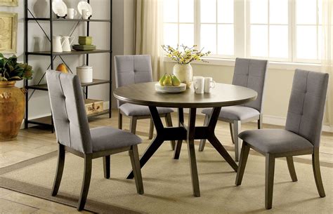 The greystone table and four chairs will look right at home in your dining room. Abelone Gray Round Dining Room Set from Furniture of ...