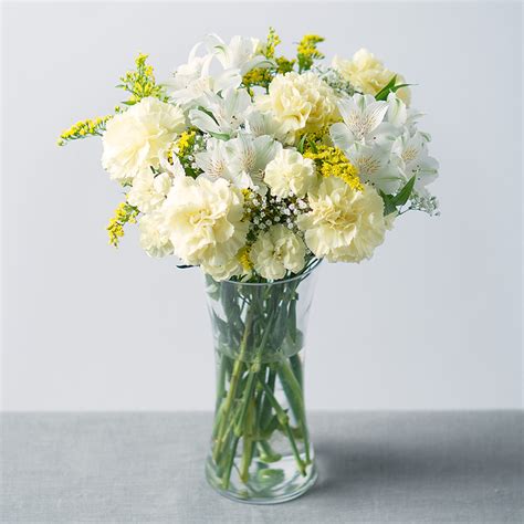 The petals and shape of the white roses actually do mean something. Sunshine Bouquet | Yellow And White Flowers | Carnations ...