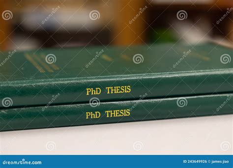 A Pile Of Phd Theses Of Green Cover Office Or Library Background Stock