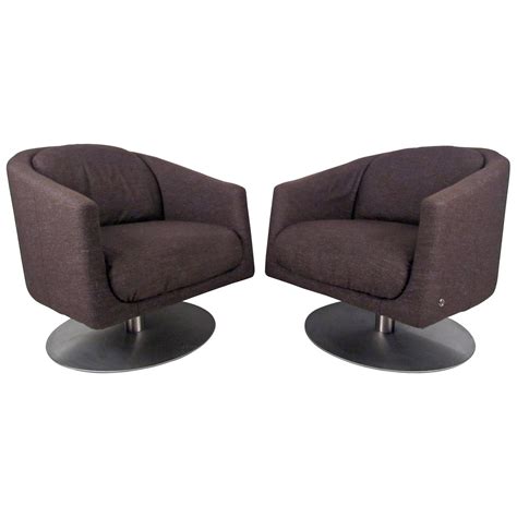 Maybe you would like to learn more about one of these? Pair of Mid-Century Natuzzi Swivel Lounge Chairs at 1stdibs