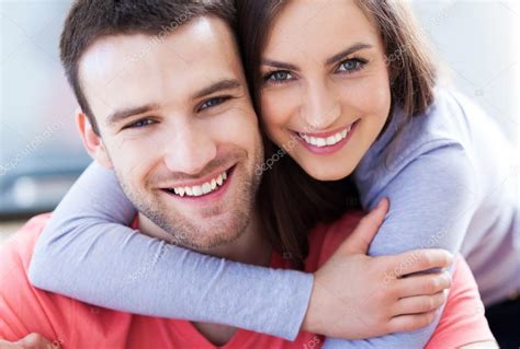 Smiling Young Couple Stock Photo By ©pikselstock 25791915