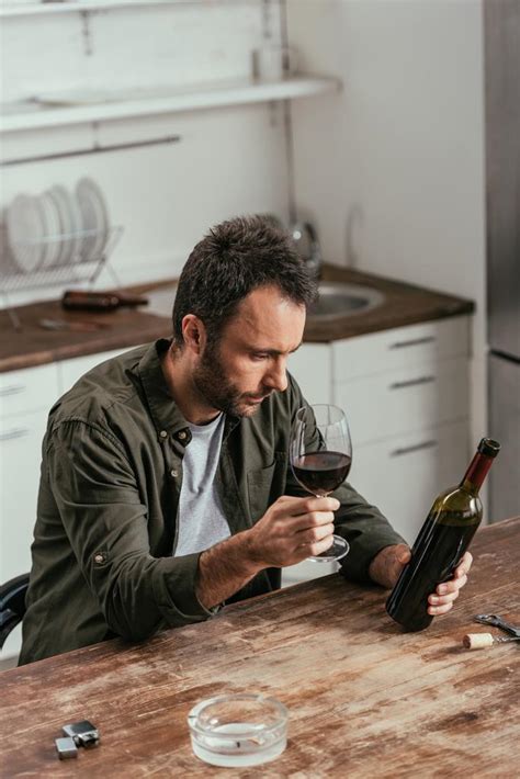 Man Holding Wine Glass And Bottle Beside Free Stock Photo And Image