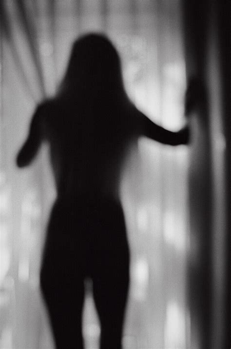 Silhouette Of Nude Woman Standing Near Bild Kaufen