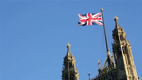 British Flag On Palace Of Westminster Houses Of Parliament In London