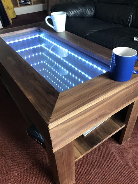 Beautiful wood grain, sculptural legs with gold painted feet and an opening with a center mirror. I built an infinity mirror coffee table for a my GCSE ...