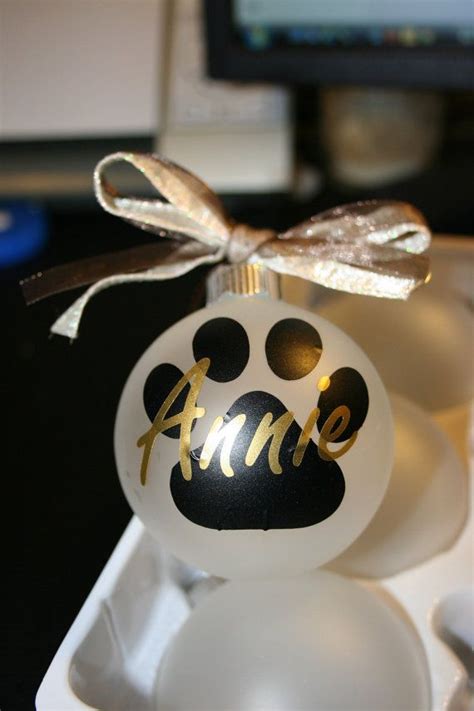 Roger the cat tests toys! Custom paw print frosted glass ornament by arkansasmade on ...
