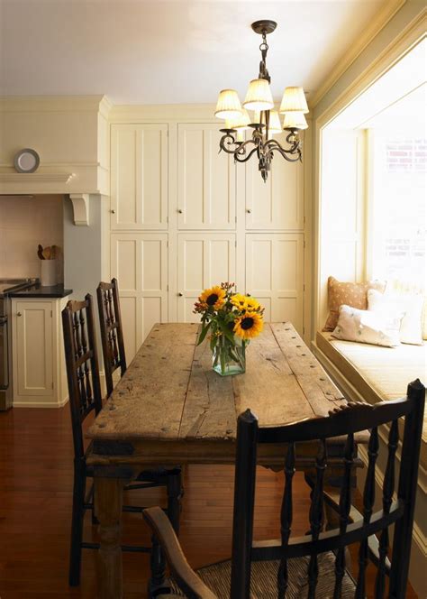 Matching the right furniture to your kitchen design is an important consideration in making the look come together. farmhouse table next to a bay window | Farmhouse table ...