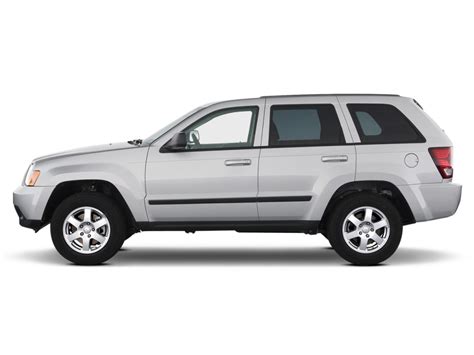 Used 2010 jeep grand cherokee laredo with 4wd, towing package, keyless entry, fog lights, trailer hitch, cargo cover, trailer. Image: 2010 Jeep Grand Cherokee RWD 4-door Laredo Side ...