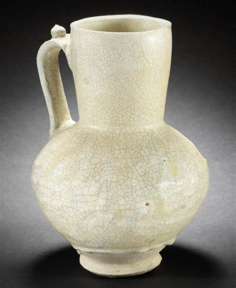 a seljuk monochrome moulded pottery jug persia 12th 13th century of inverse pear shape on a