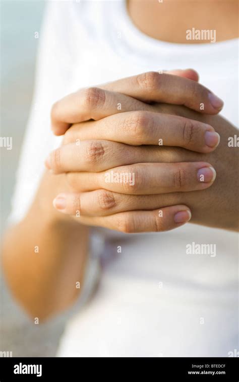 Womans Clasped Hands Stock Photo Alamy