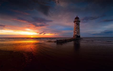 Lighthouse Sea Sunset Hd Wallpaper Background Image 1920x1200