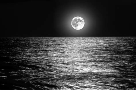 The Moon Over The Sea Horizon At Night Moonlight On The Waves Stock