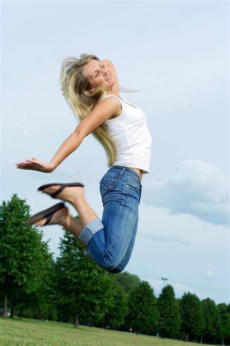 Happy Jumping Woman Picture Image 5628657